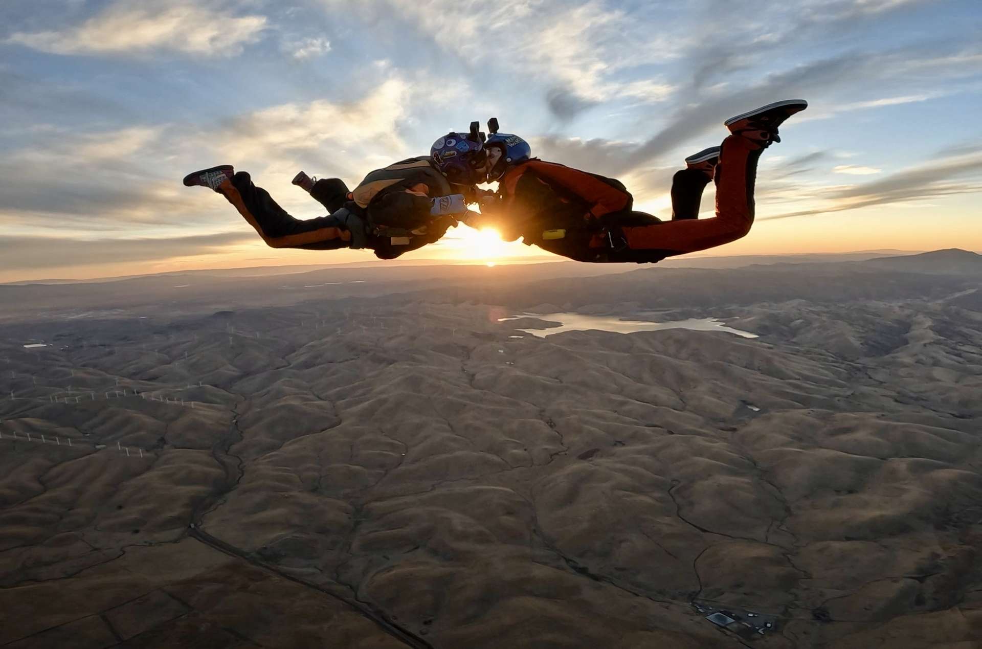 Tandem skydiving at sunset